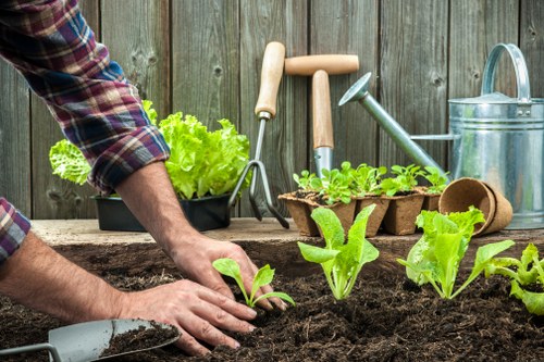 Gardening team preparing site with safety equipment